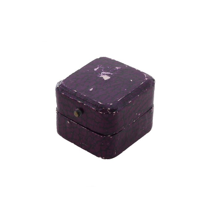 a scratched purple antique ring box