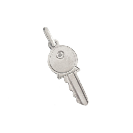 a vintage sterling silver key charm