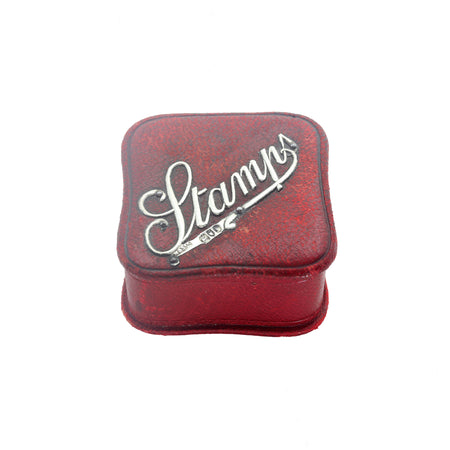 an edwardian square silver and red stamp box