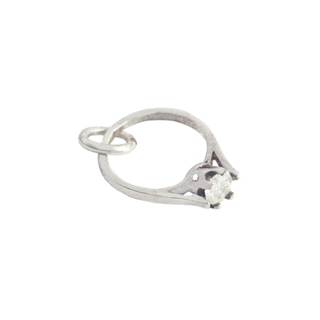 a vintage silver engagement ring charm