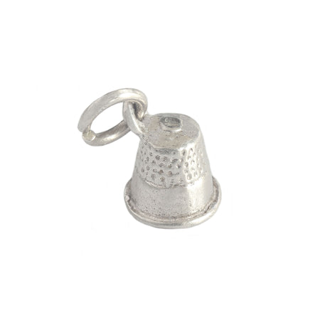 a secondhand thimble charm in silver