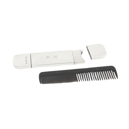 a silver small comb with case asprey and co