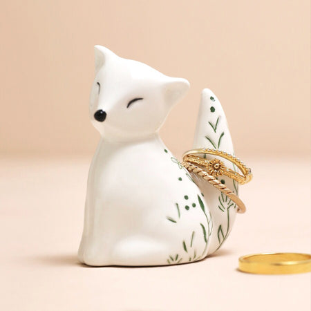 a fox ceramic ring holder with green leaf pattern