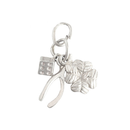 a vintage silver set of clover wishbone and lucky dice charm