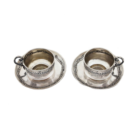 a silver antique french cup saucer set