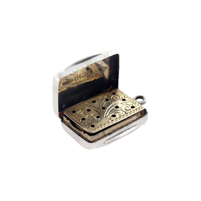 an opened up silver gilt vinaigrette