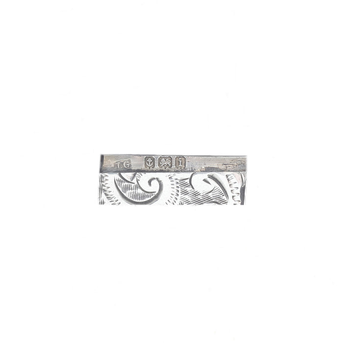 scroll pattern with close up of hallmark on a silver vesta case