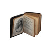 a miniature hymns book inside cover 