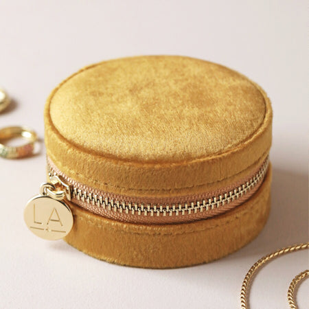 mustard velvet round zipped jewellery travel case with floral design inside