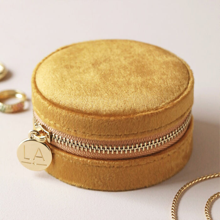 mustard velvet round zipped jewellery travel case with floral design inside