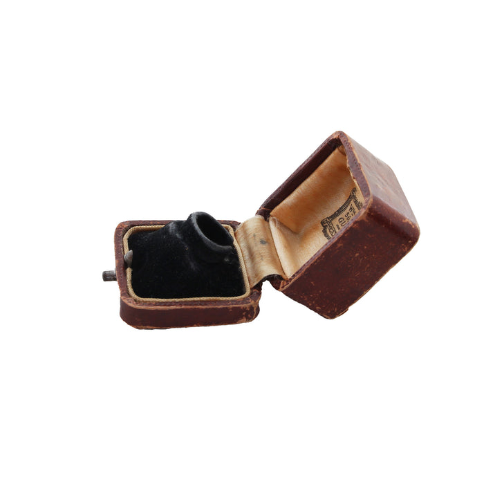 an old ring box black interior brown exterior