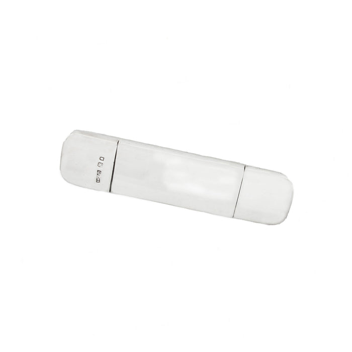 rectangular silver case with grooves and hallmark comb