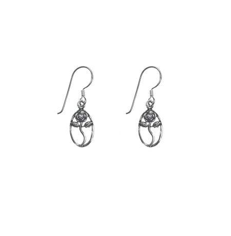 a pair of silver tulip flower drops in a border