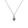 a small detailed perfume bottle with a turquoise stone pendant on a silver chain