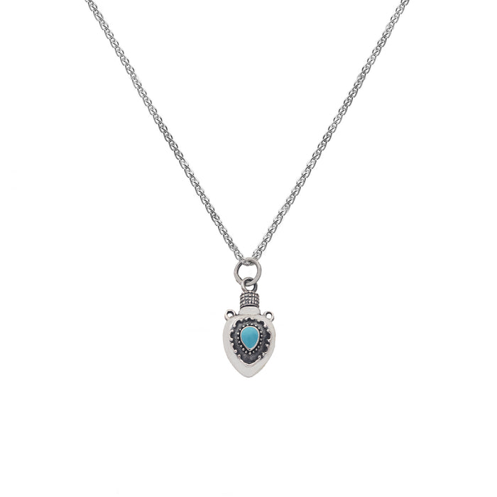 a small detailed perfume bottle with a turquoise stone pendant on a silver chain